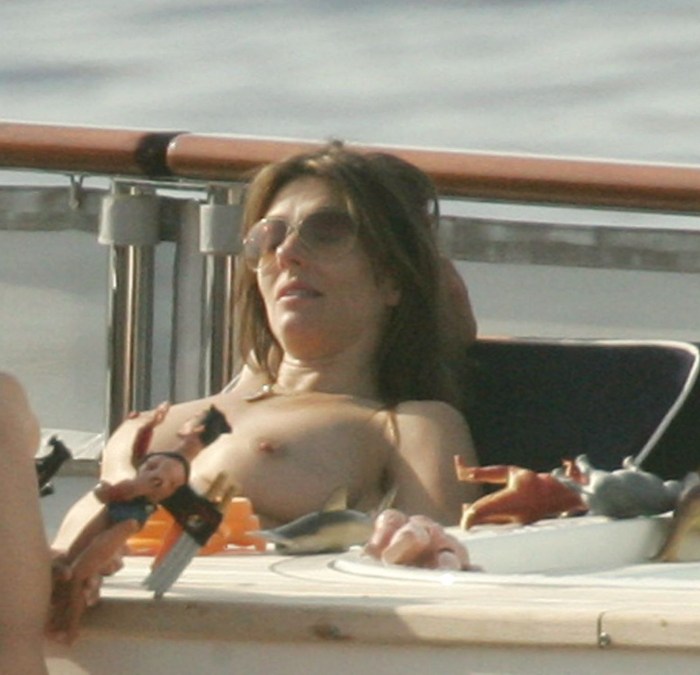 Elizabeth Hurli on the yacht topless
