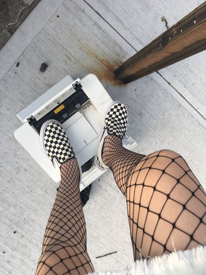 Beautiful butt in pantyhose in a grid