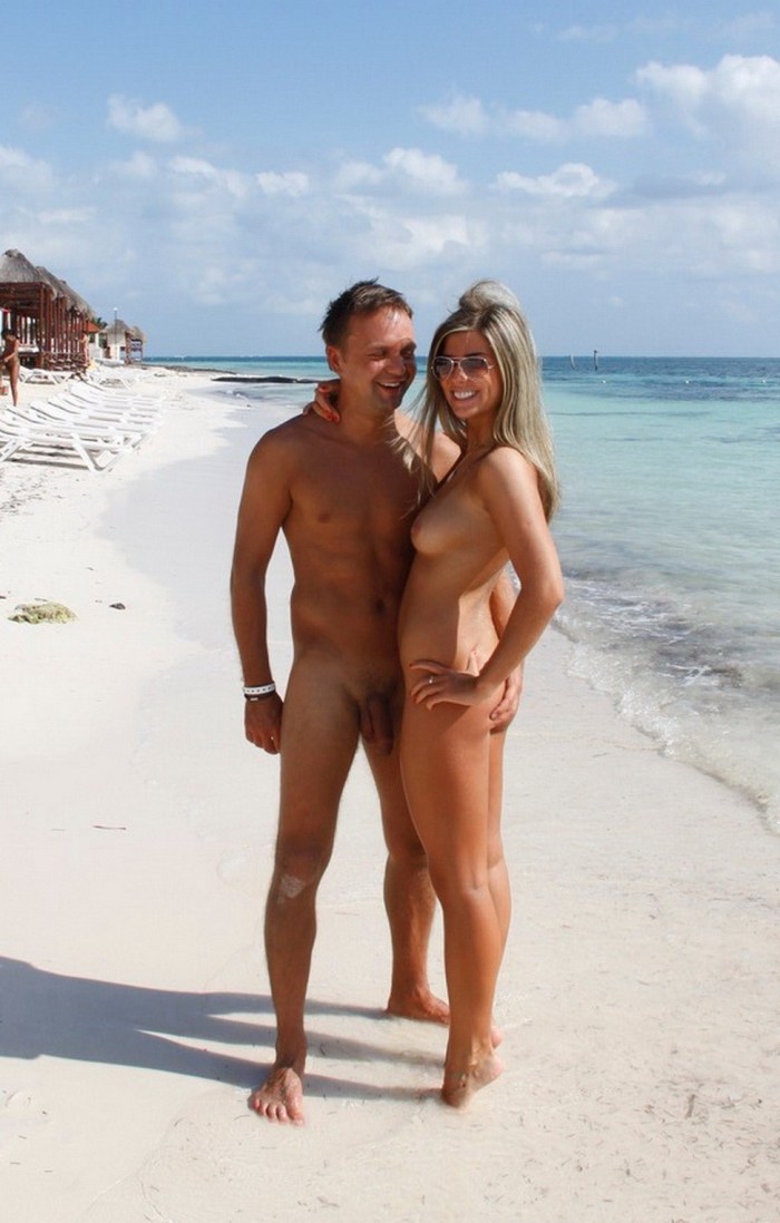 Naked girls with guys on the beach