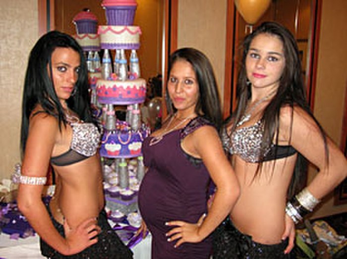 Girl with a phone in bed