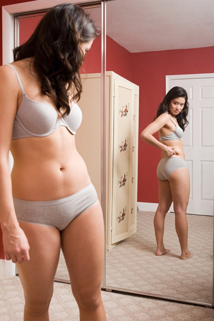 Woman in Underwear by Mirror