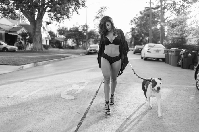 Girl with a dog on a leash