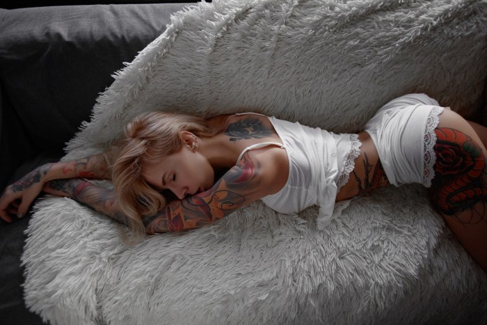 Tattooed girls in bed