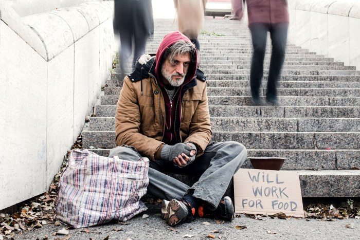 A beggar with money