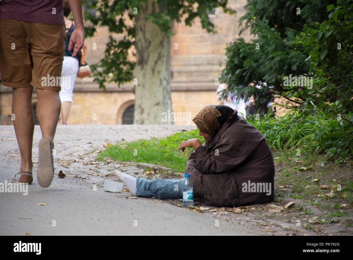 The girl is lying on the street