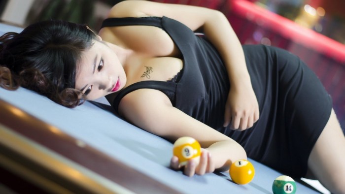 Girl on a billiard table
