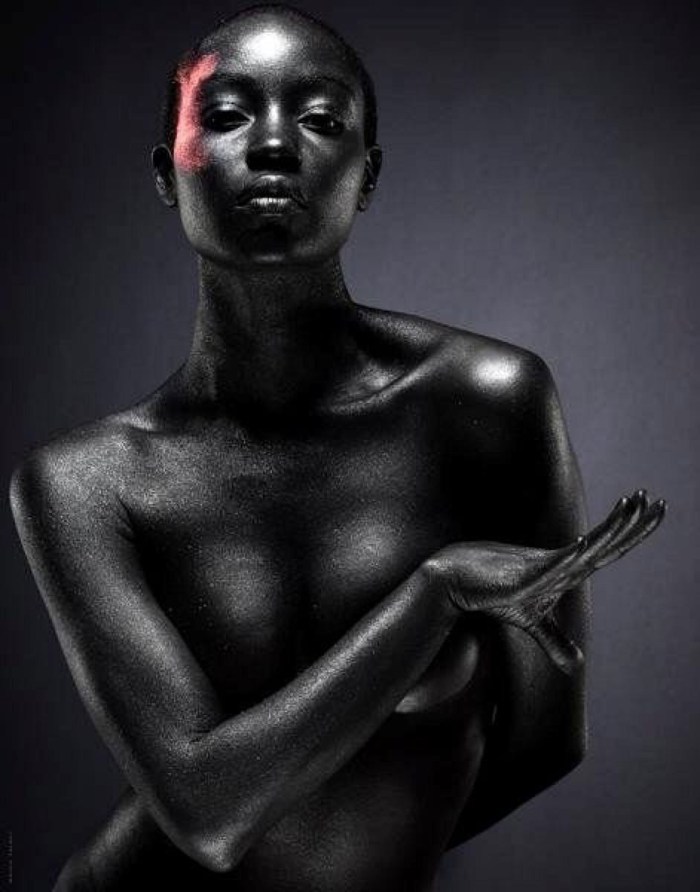 Portrait of a black girl in sheets