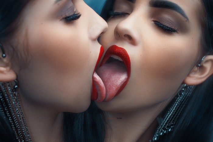 Two girls lick