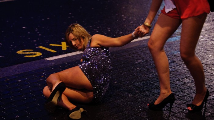 Drunk woman lying on the street