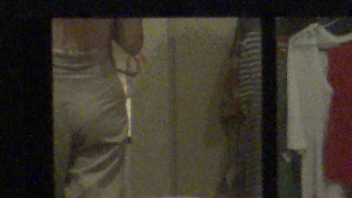 I peered behind a naked neighbor out the window