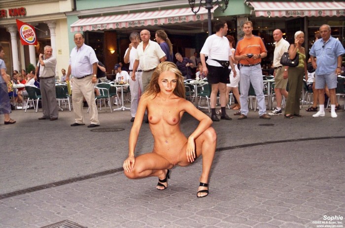 The girl undresses in public