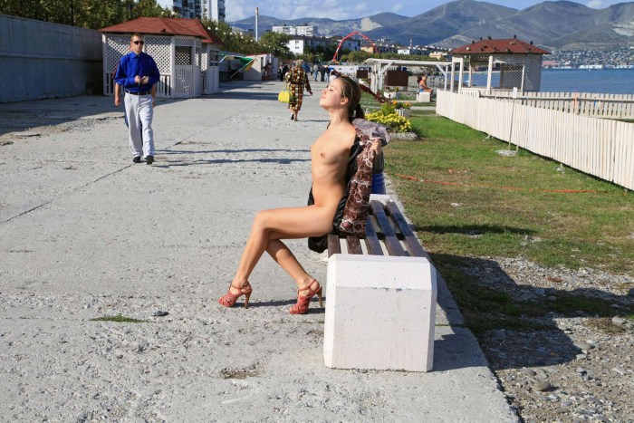 Naked women in the windows of houses