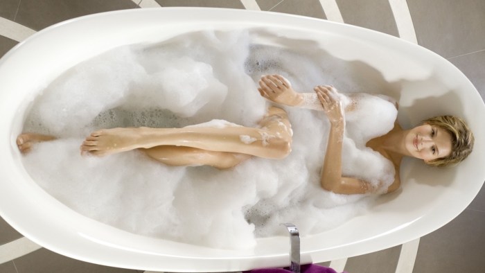 Girl lies in the bathroom