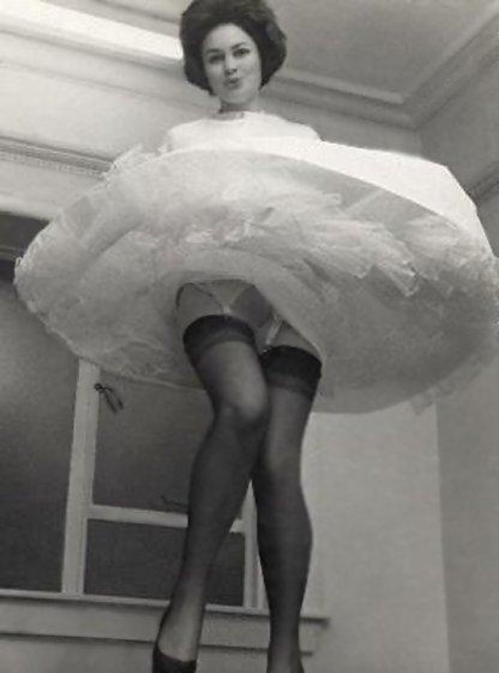 Margaret Nolan in stockings and belt