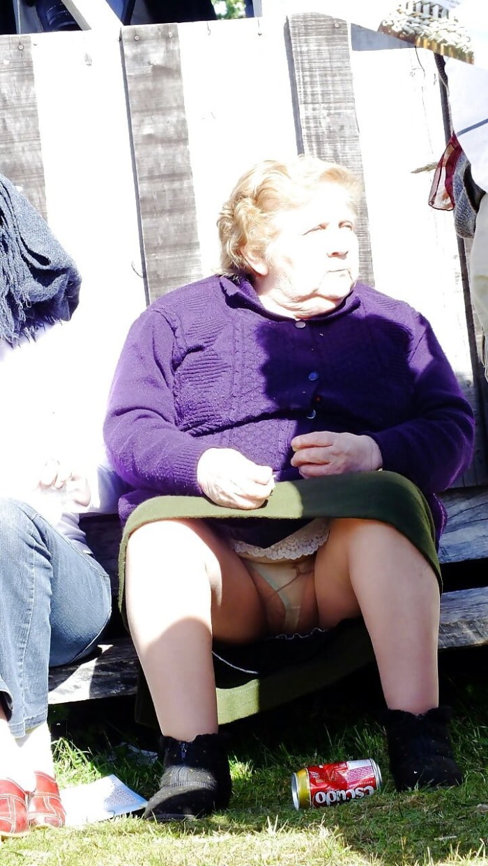 Old woman in a skirt without panties