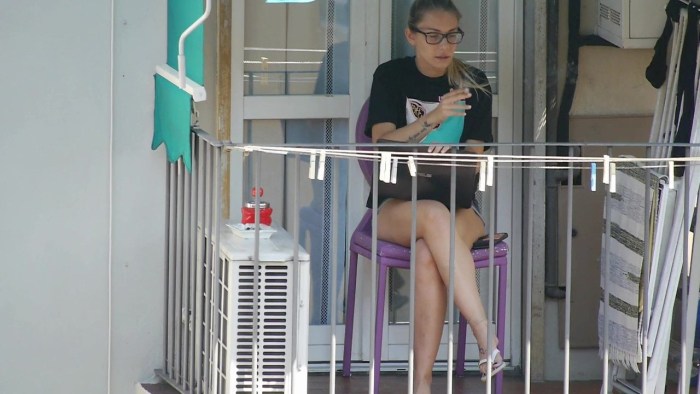 A neighbor on the balcony