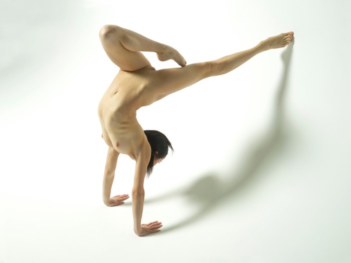 Naked gymnasts spread their legs