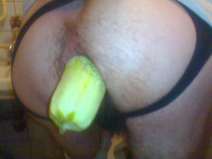 Girl with zucchini in a glass
