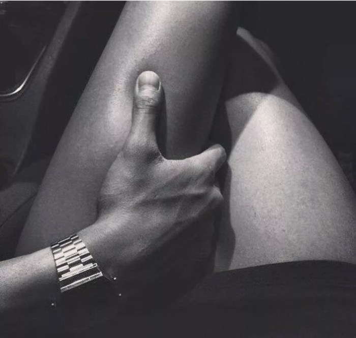 Male hand on a female leg