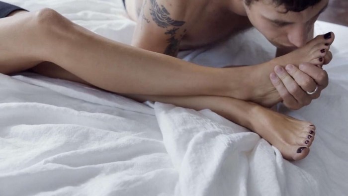 The girl leaned on the bed