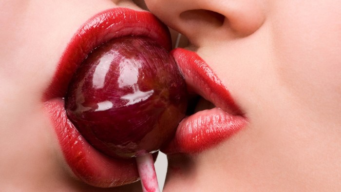 Female lips with a tongue