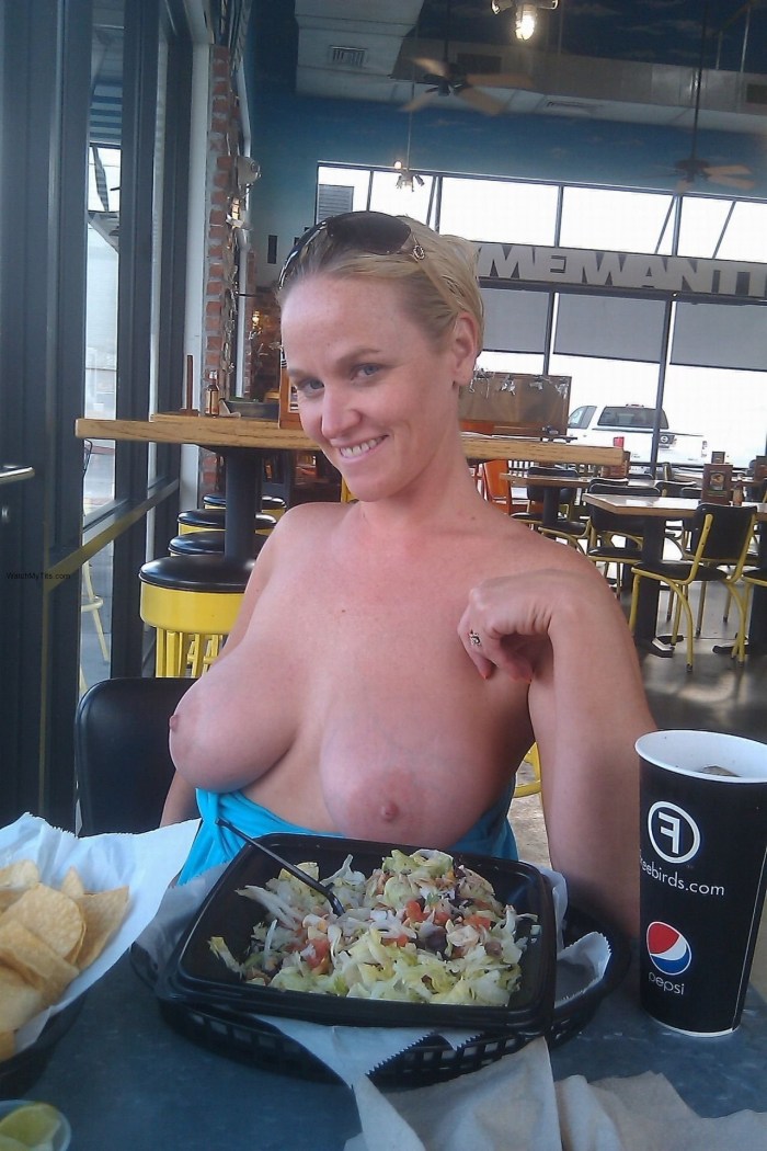 Women show boobs in a cafe
