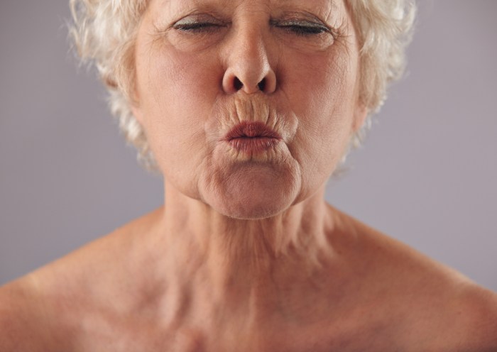 Elderly women with an open mouth