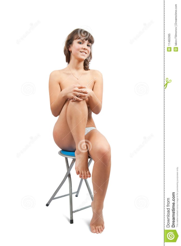 Sits on a chair with legs spread