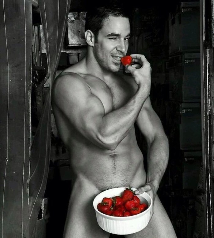 Naked man and strawberries