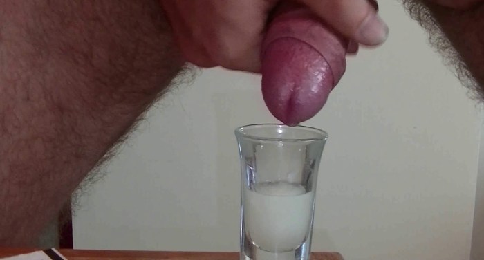 Penis cums in a glass