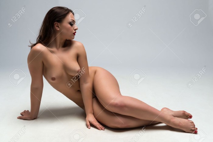Naked woman lies on the floor
