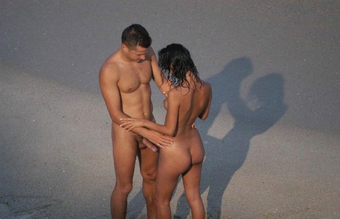 Naked men and women on the beach