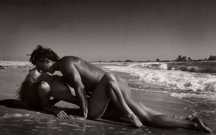 Naked men and women on the beach