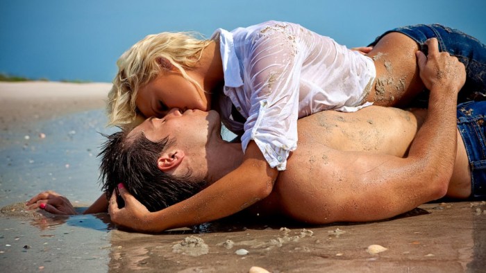 Naked woman and man on the shore