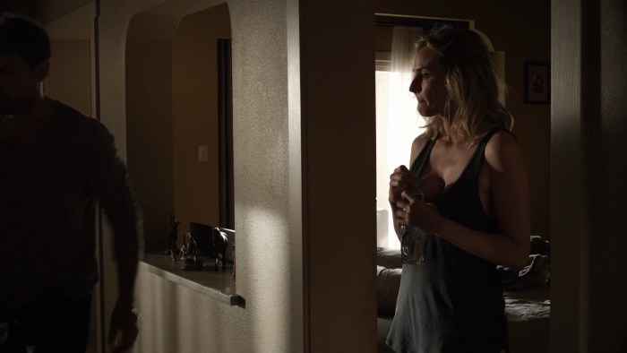 Girls in boots are sitting on a stone