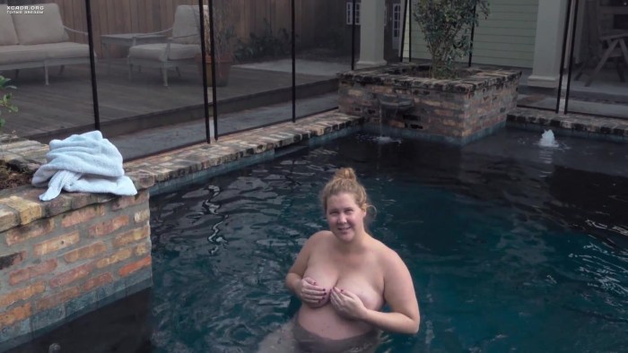 Naked pregnant woman in the pool