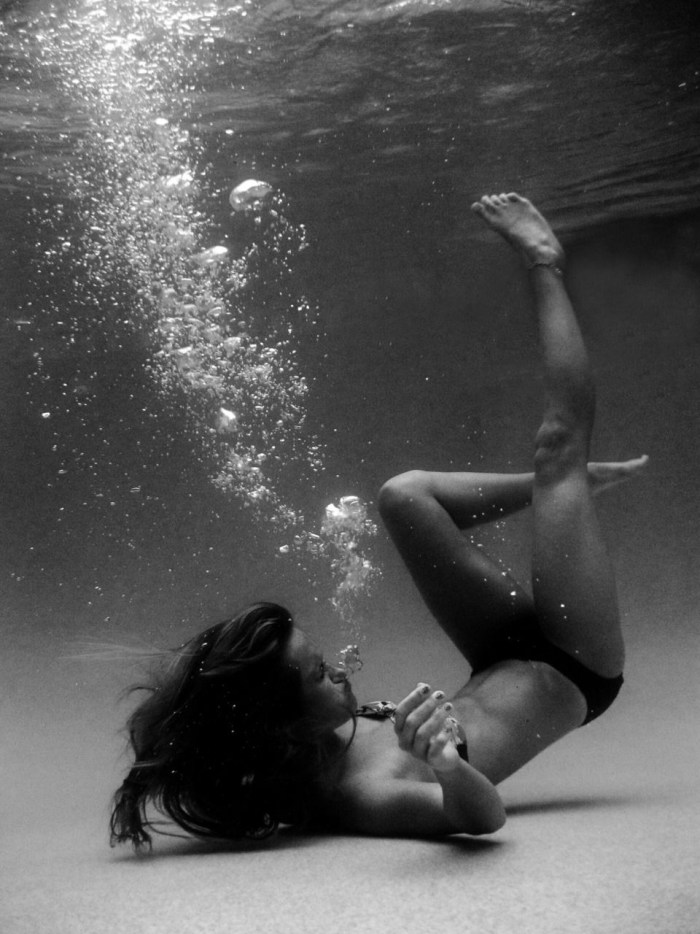 Girl sinking in water