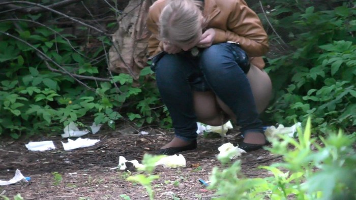 The girl crouched in the bushes