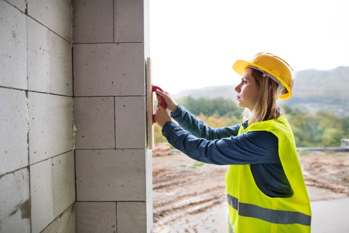 Model woman who works at a construction site