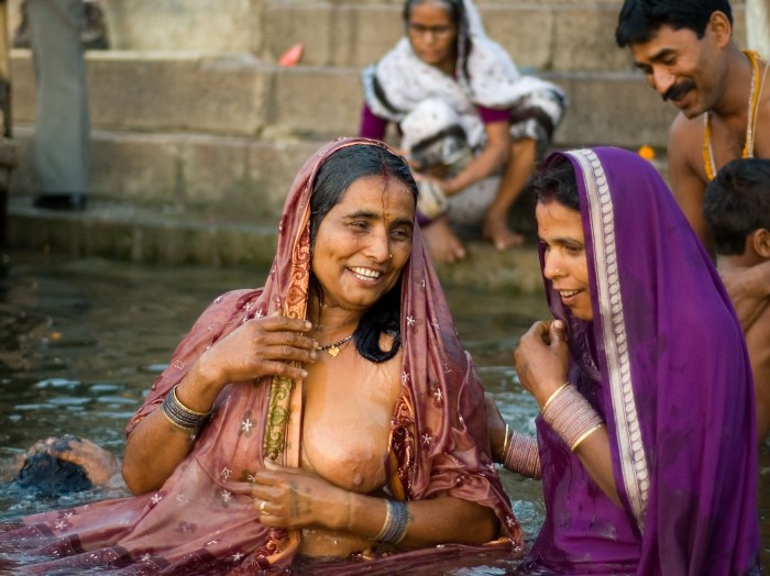 Indian women bathe