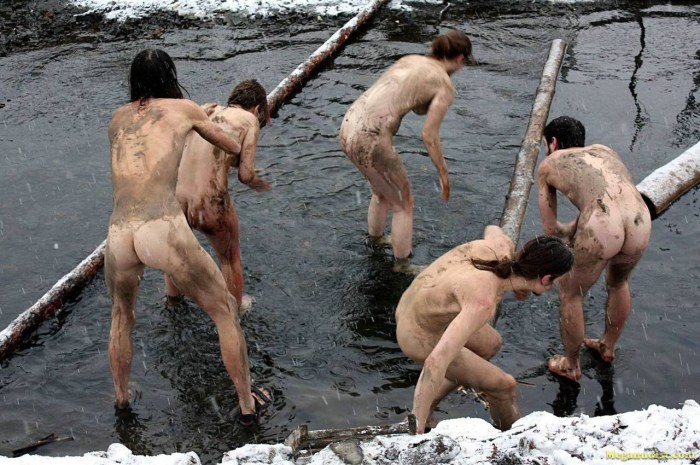 Naked guys bathing in the hole