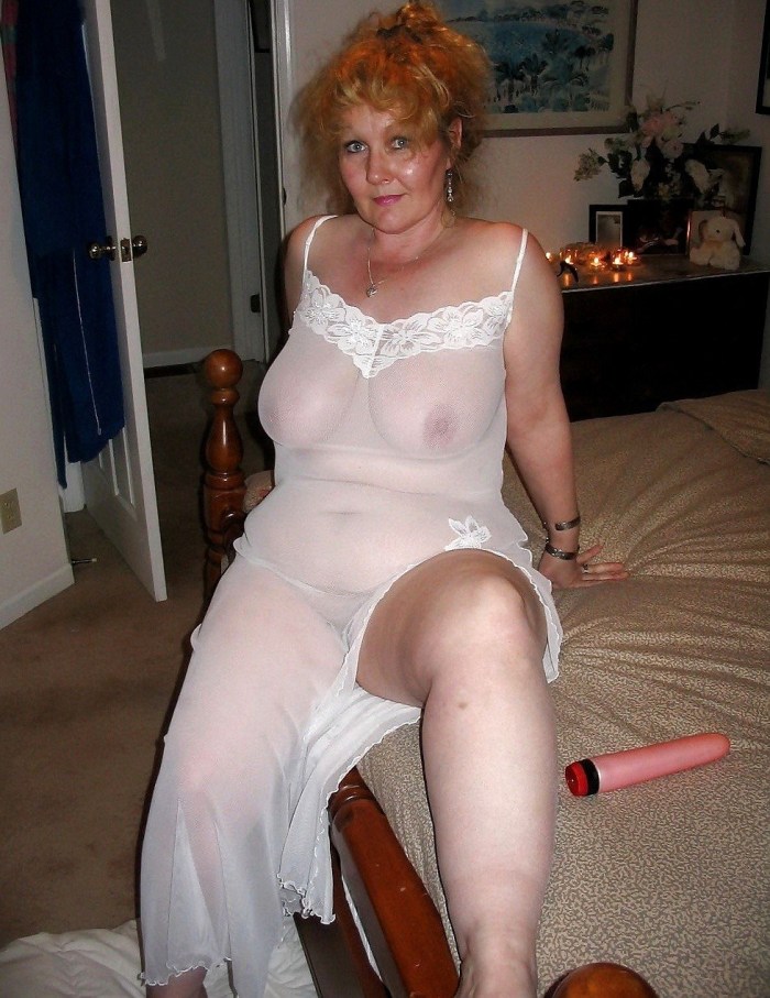 Old woman naked in transparent clothes