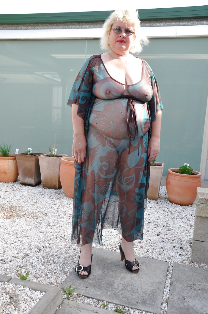 Naked old women in a transparent dress