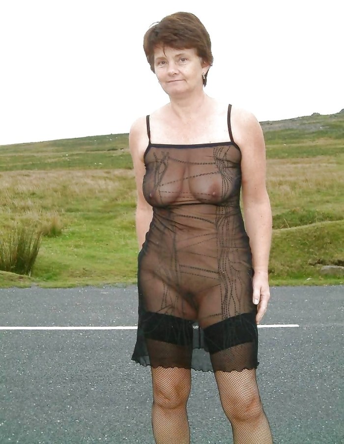 Old woman naked in transparent clothes