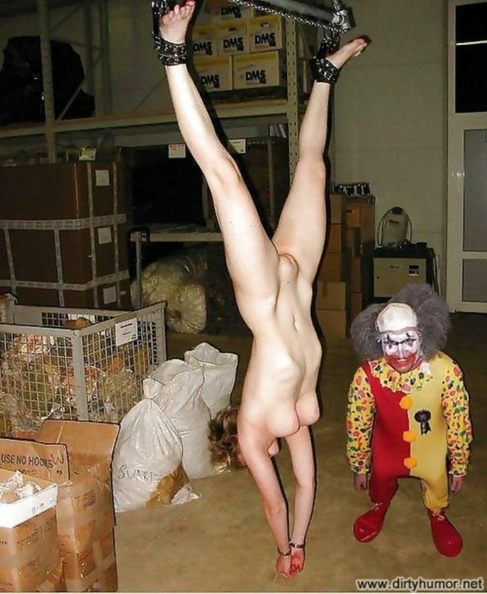 Naked hung by the legs