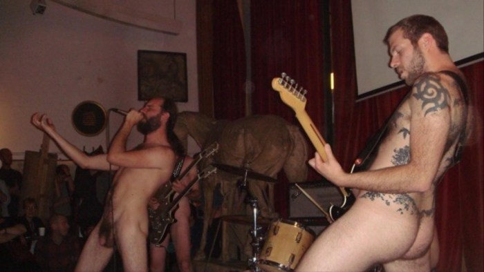 Naked rock musicians on stage